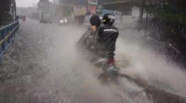 Dramatic Motorcycle Riders Break Through Flash Floods in Bandung City, West Java, Indonesia