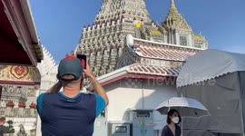 Tourists visit Thailand’s famous Wat Arun temple as Covid-19 measures ease
