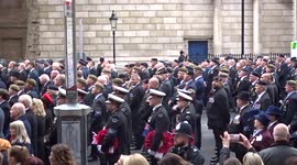 Participants of Remembrance Sunday parade sing God Save The Queen on Whitehall in London