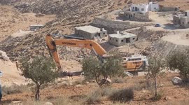 An Israeli bulldozer demolished a Palestinian house located under the pretext of building without a permit  in Yatta south of Hebron