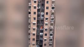 Chinese resident calls emergency services after mistaking reflection of fire for blaze in flat