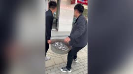 Men gift friend bucket of almost 10,000 coins as wedding gift in China