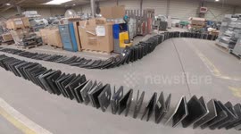 Belgium tech team breaks world record for the longest domino chain of LAPTOPS