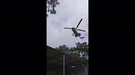 Residents flee as helicopter downdraft shatters trees in Indonesia