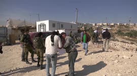 The Israeli army prevents Palestinian farmers from reaching their lands to pick olives