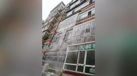 Wall of ice forms on residential building as baltic weather hits northern China