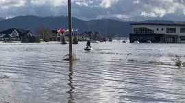 Man takes advantage of British Columbia floods by riding jet ski through submerged streets