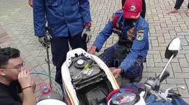 Shocked motorcycle rider finds snake inside his engine