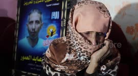 The family of the Palestinian prisoner, Sami Al-Amour sit at their home, in Deir al-Balah camp in the central Gaza Strip.