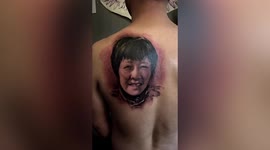 Touching tribute: Chinese man tattoos dead mother's face on his back