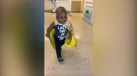 Hero toddler who's beaten cancer wears his special cape into last round of chemo
