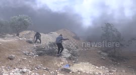Palestinian protesters and Israeli security forces clash following a demonstration against settlements in the village of Beita in the West Bank