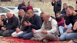 Palestinian residents of house slated for demolition attend Friday prayers in the east Jerusalem neighbourhood of al-Tur