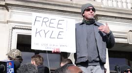 Man holds 'Free Kyle' sign on steps of Kenosha courthouse and says, 'It's not about race'