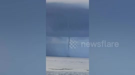 Waterspout tornado forms off southwestern Philippine coast