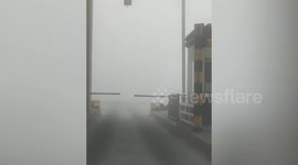 Driving through dense fog in Beijing as heavy pollution covers Chinese capital