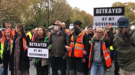 Insulate Britain demonstrate in support of jailed protesters in front of Royal Courts of Justice, London