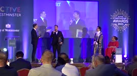 Winner of Active Westminster 2021 Lifetime Achievement Award Phil Rumbelow speaks on stage of Porchester Hall