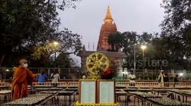 Buddhist monks prayed by candlelight at the Mahabodhi Temple for world peace and the end of Covid-19, Bodh Gaya, India