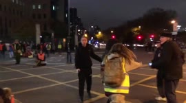 Altercation breaks out in London's Vauxhall as angry woman sprays liquid at Insulate Britain's protesters. Man is left with broken glasses and face scratches