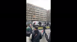 Protesters in Brussels kick out at police van as tens of thousands gather against tighter COVID rules