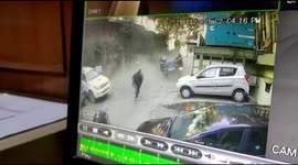 Terrifying moment vehicle skids off road and crashes onto car park below in northern India