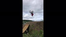 A guy does a backflip with a Bike in a Freestyle Bike Park in Harstad, Norway