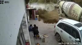Villagers narrowly escape being buried in sand after transport truck tips over in China
