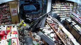 Motorist smashes SUV through supermarket wall, scattering goods across floor in China