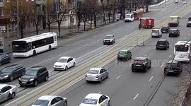 Fire engine blocks traffic to help elderly woman cross busy highway in Russia