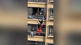 Elderly woman dangles upside down on clothes hanger after falling off 19th floor balcony in China