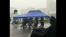 Gazebo used as makeshift group umbrella in China