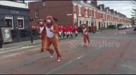 Stag party dressed as foxes and hunters run through Newcastle