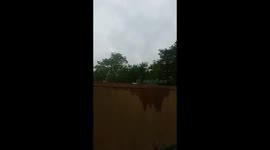 Nude man trampolines past modesty screen at Secret Garden Party