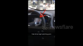 NYC taxi driver watches porn at the wheel