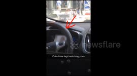 NYC taxi driver watches porn while driving