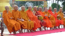 Making merit for Khao Pansa, buddhist lent