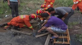 Man rescued from tar pit in China