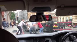 'Uber drivers' and passenger brawl in London street