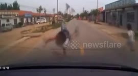 Moment child miraculously walks away from car accident in China