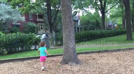 Kid chasing squirrel in circles around a tree