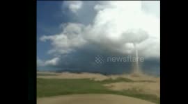 Odd tornado touches down in West China