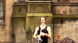 man Juggles while swallowing a sword