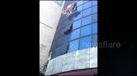 Child leaps to safety from burning building