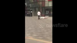 Beijing Uniqlo sword 'attacker' wanders calmly outside store