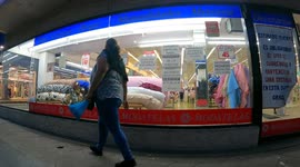 Time lapse of people shopping in downtown Hermosillo Mexico, at night walking among the lights of the city a few weeks before Christmas and New Years. Daily life. State of Sonora border with Arizona United States