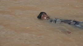 Kids can't hide their smiles as they enjoy swimming in flood-ravaged southern India
