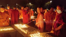 Buddhist monks light lamps and offer prayers for 'pandemic free world'