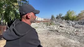 Palestinian man inspects the rubbles of his house after Israeli bulldozers demolished it