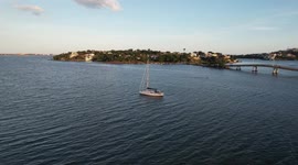 A beautiful sailing boat in the middle of the bay waiting for nightfall in the city of Vitória in Brazil
